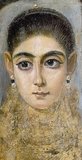 Mummy portraits or Fayum mummy portraits (also Faiyum mummy portraits) is the modern term given to a type of naturalistic painted portraits on wooden boards attached to mummies from the Coptic period. They belong to the tradition of panel painting, one of the most highly regarded forms of art in the Classical world. In fact, the Fayum portraits are the only large body of art from that tradition to have survived.<br/><br/>

Mummy portraits have been found across Egypt, but are most common in the Faiyum Basin, particularly from Hawara and Antinoopolis, hence the common name. 'Faiyum Portraits' is generally thought of as a stylistic, rather than a geographic, description. While painted Cartonnage mummy cases date back to pharaonic times, the Faiyum mummy portraits were an innovation dating to the Coptic period at the time of the Roman occupation of Egypt.<br/><br/>

They date to the Roman period, from the late 1st century BCE or the early 1st century CE onwards. It is not clear when their production ended, but recent research suggests the middle of the 3rd century. They are among the largest groups among the very few survivors of the highly prestigious panel painting tradition of the classical world, which was continued into Byzantine and Western traditions in the post-classical world, including the local tradition of Coptic iconography in Egypt.
